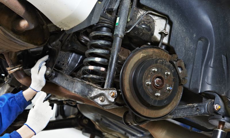 Close-up of heavy-vehicle suspension and shock components